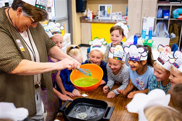 Students learning about Green Eggs and Ham and how to make them. 